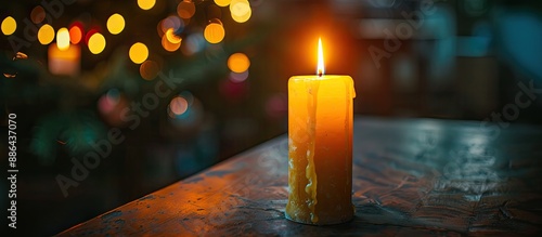 A solitary candle flame ill...