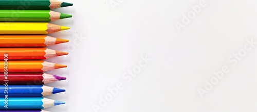 Rainbow color pencils on a ...