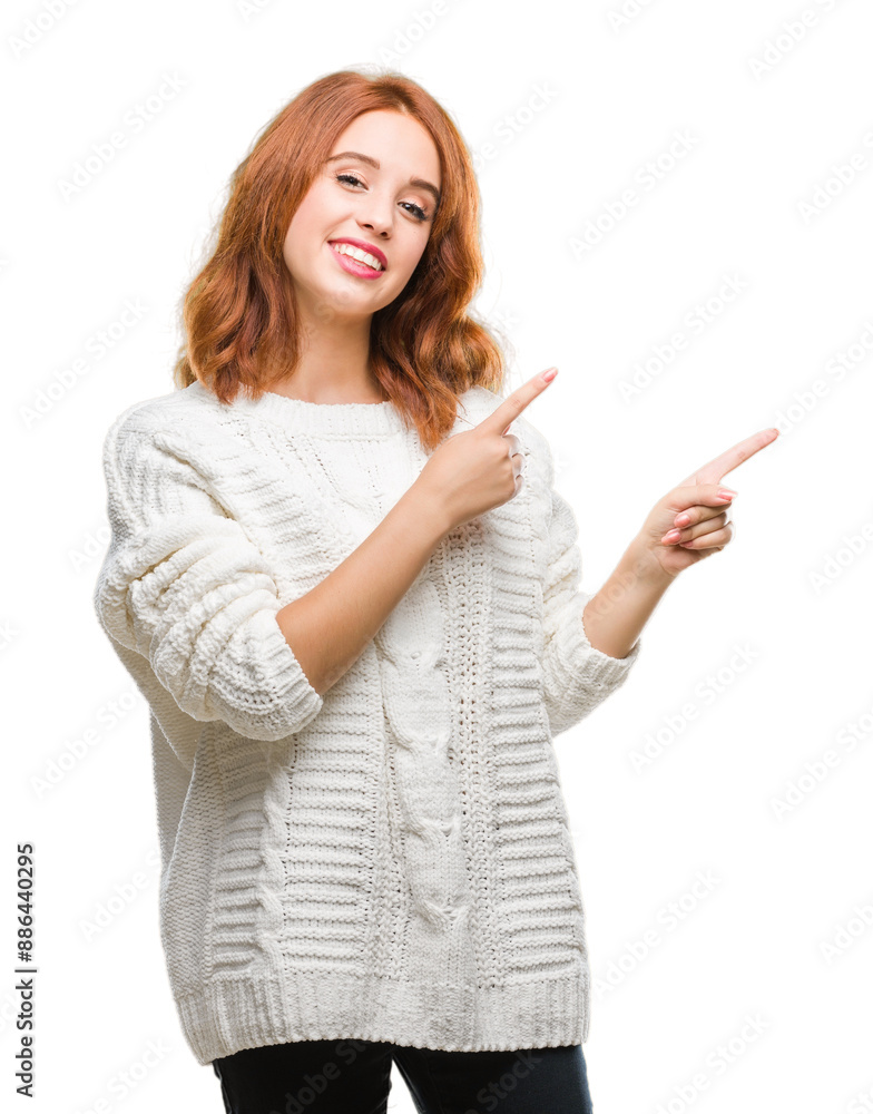 Young beautiful woman over isolated background wearing winter sweater smiling and looking at the camera pointing with two hands and fingers to the side. Young beautiful woman over isolated background wearing winter sweater smiling and looking at the camera pointing with two hands and fingers to the side.