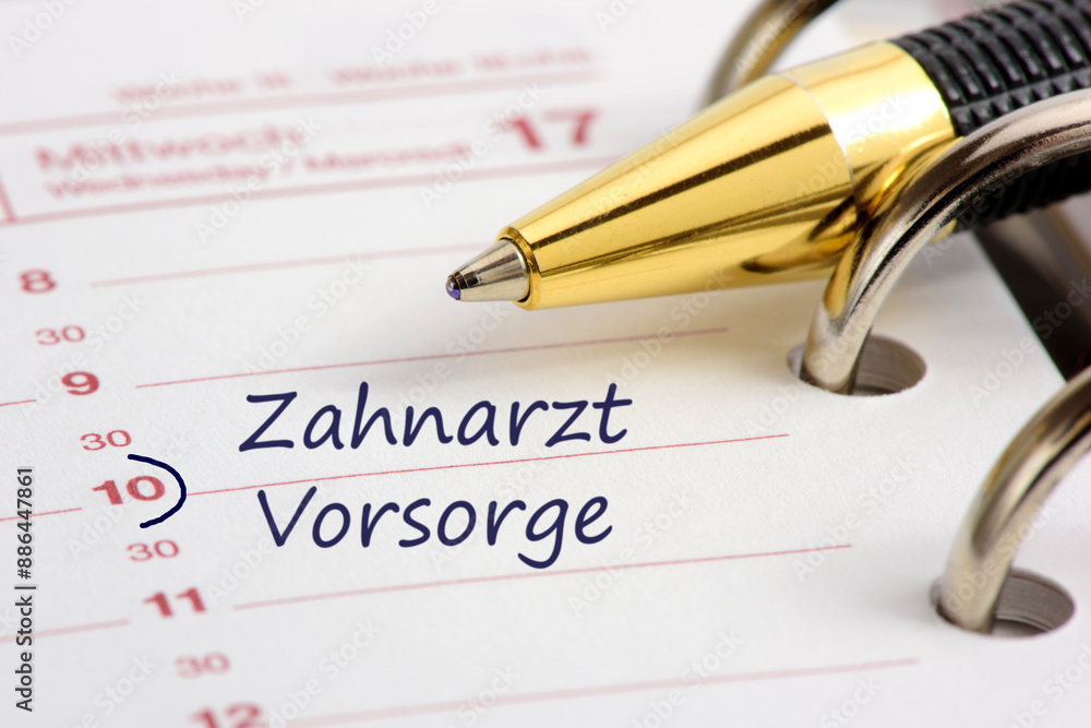 Fototapeta premium Ein Terminentrag im Kalender für Zahnarzt und Vorsorge