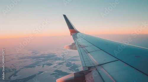 A close-up of an airplane wing against a clear sky, with space for overlaying text and images