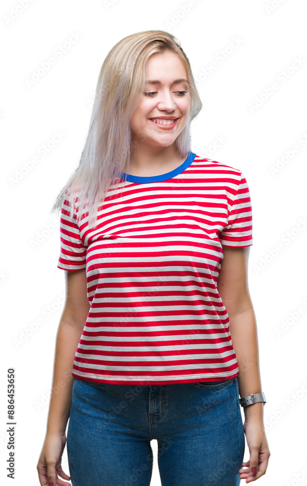 Young blonde woman over isolated background looking away to side with smile on face, natural expression. Laughing confident. Young blonde woman over isolated background looking away to side with smile on face, natural expression. Laughing confident.