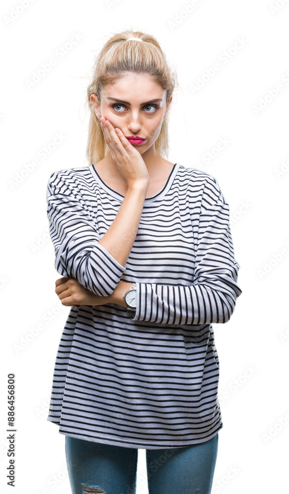Young beautiful blonde woman wearing stripes sweater over isolated background thinking looking tired and bored with depression problems with crossed arms. Young beautiful blonde woman wearing stripes sweater over isolated background thinking looking tired and bored with depression problems with crossed arms.