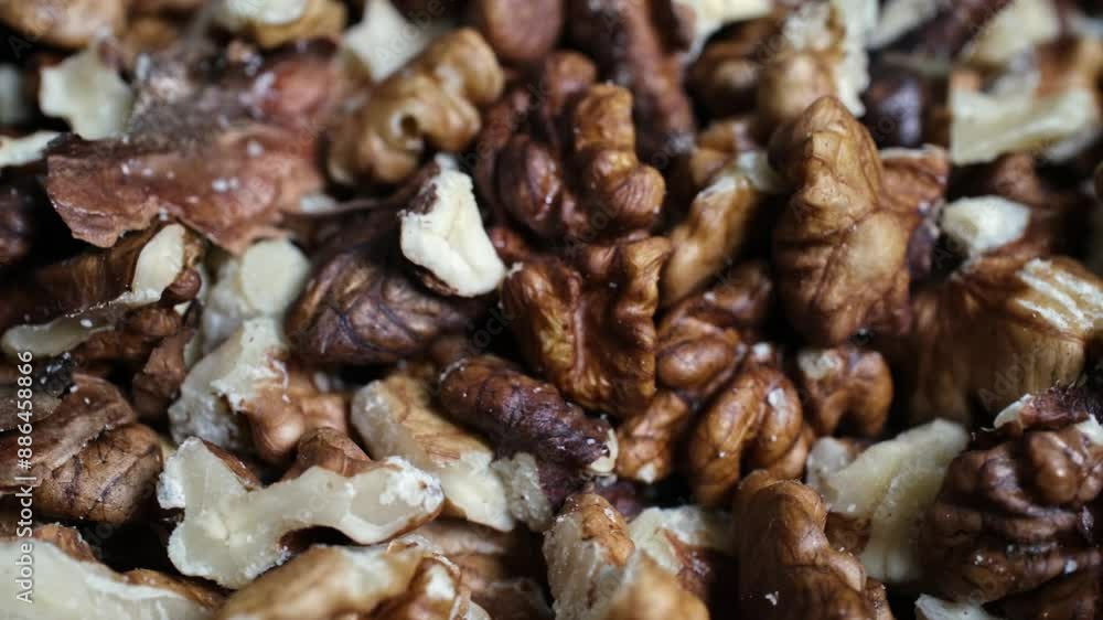 Walnut kernels on rotating ground in close-up Walnut kernels on rotating ground in close-up