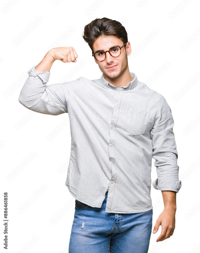 Young handsome man wearing glasses over isolated background Strong person showing arm muscle, confident and proud of power Young handsome man wearing glasses over isolated background Strong person showing arm muscle, confident and proud of power