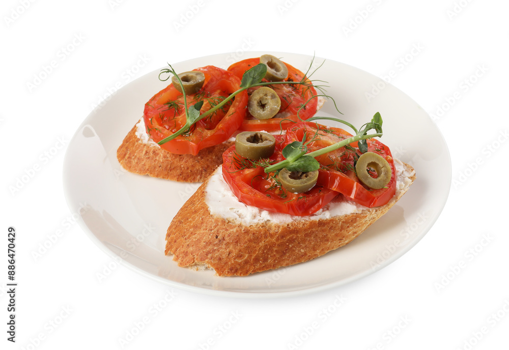 Delicious ricotta bruschettas with sliced tomatoes, olives and greens isolated on white