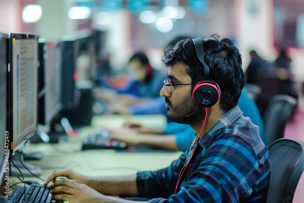 Information technology photography with Indian tech worker and computers in out of focus background Generative Ai Information technology photography with Indian tech worker and computers in out of focus background Generative Ai