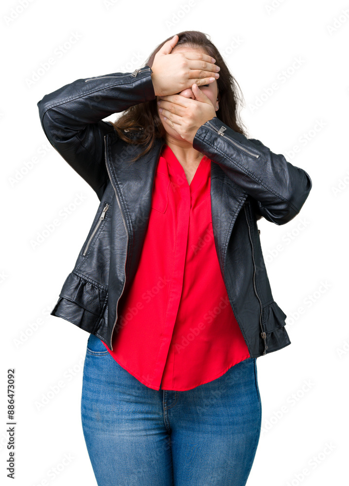 Beautiful plus size young woman wearing a fashion leather jacket over isolated background Covering eyes and mouth with hands, surprised and shocked. Hiding emotion Beautiful plus size young woman wearing a fashion leather jacket over isolated background Covering eyes and mouth with hands, surprised and shocked. Hiding emotion