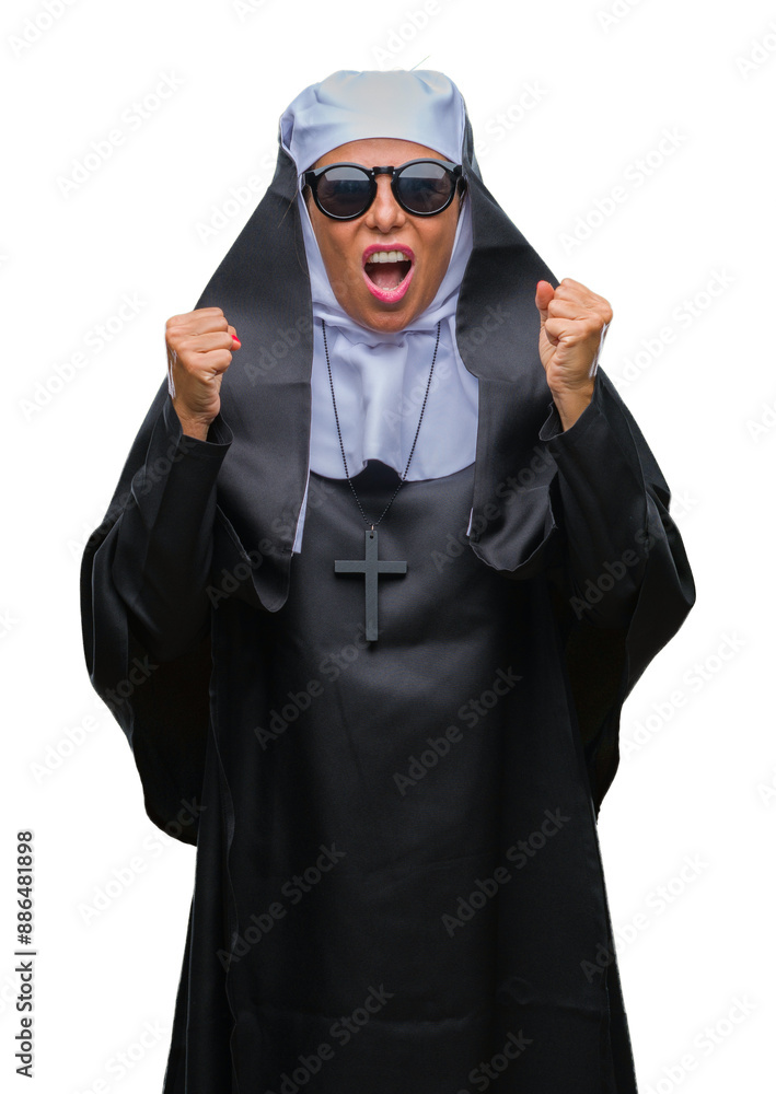 Middle age senior catholic nun woman wearing sunglasses over isolated background celebrating mad and crazy for success with arms raised and closed eyes screaming excited. Winner concept Middle age senior catholic nun woman wearing sunglasses over isolated background celebrating mad and crazy for success with arms raised and closed eyes screaming excited. Winner concept