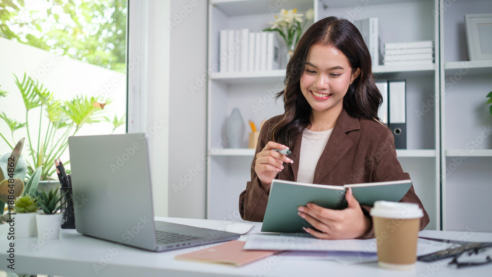 Thoughtful asian businesswoman checking financial reports at her office desk. Thoughtful asian businesswoman checking financial reports at her office desk.