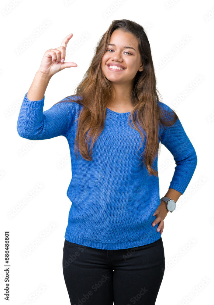 Young beautiful brunette woman wearing blue sweater over isolated background smiling and confident gesturing with hand doing size sign with fingers while looking and the camera. Measure concept. Young beautiful brunette woman wearing blue sweater over isolated background smiling and confident gesturing with hand doing size sign with fingers while looking and the camera. Measure concept.