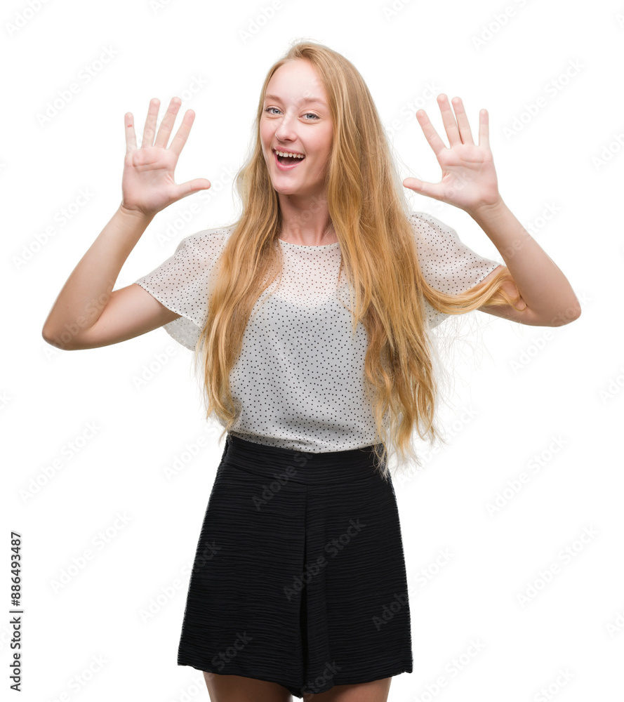 Blonde teenager woman wearing moles shirt showing and pointing up with fingers number ten while smiling confident and happy. Blonde teenager woman wearing moles shirt showing and pointing up with fingers number ten while smiling confident and happy.
