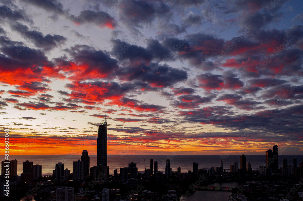 Aerial citscape view over Surfers Paradise with a colourful pink clouds, sunrise sky. Gold Coast, Australia. Aerial citscape view over Surfers Paradise with a colourful pink clouds, sunrise sky. Gold Coast, Australia.