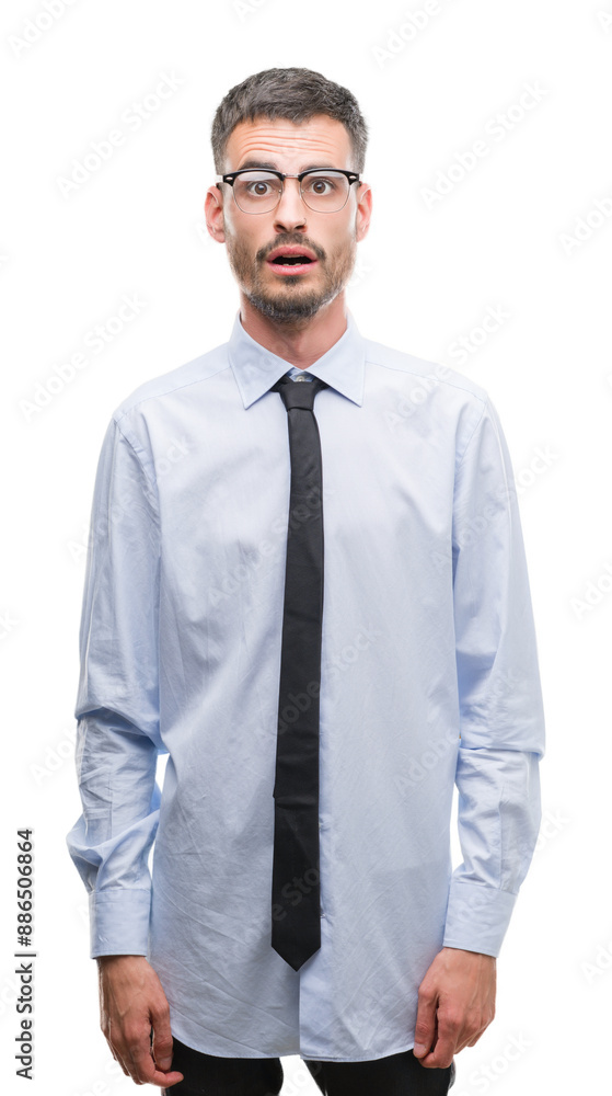 Young business man scared in shock with a surprise face, afraid and excited with fear expression Young business man scared in shock with a surprise face, afraid and excited with fear expression