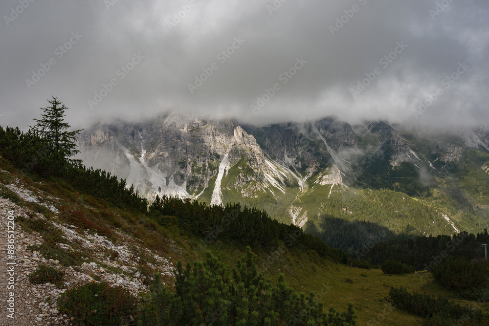 Stubai Valley seen from a mountainside near Fulpmes and Neustift, just below a thick layer of clouds, capturing the alpine scenery. Stubai Valley seen from a mountainside near Fulpmes and Neustift, just below a thick layer of clouds, capturing the alpine scenery.