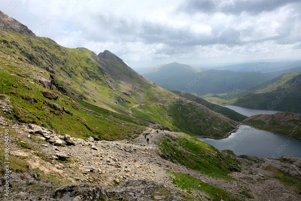 The Miners’ and Pyg Track converge at the base of Crib Goch ridge, adjacent to Glaslyn lake, in the Snowdonia Mountain Range, North Wales. The Miners’ and Pyg Track converge at the base of Crib Goch ridge, adjacent to Glaslyn lake, in the Snowdonia Mountain Range, North Wales.