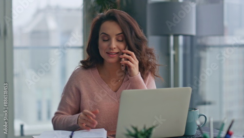 Happy woman talking mobile phone in remote office closeup. Lady reading contract