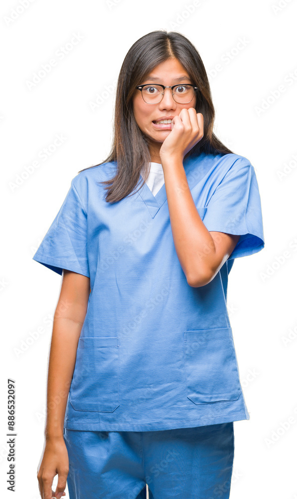 Young asian doctor woman over isolated background looking stressed and nervous with hands on mouth biting nails. Anxiety problem. Young asian doctor woman over isolated background looking stressed and nervous with hands on mouth biting nails. Anxiety problem.