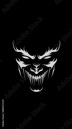 White devil face smiling with angry look isolated on solid black background