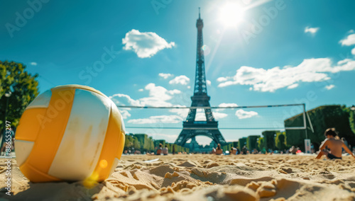 Beach Volleyball Fun in Paris Olympic Spirit. A vivid image of a yellow and white volleyball on a sandy beach court with the Eiffel Tower in the background, embodying summer sports and joy.
 photo