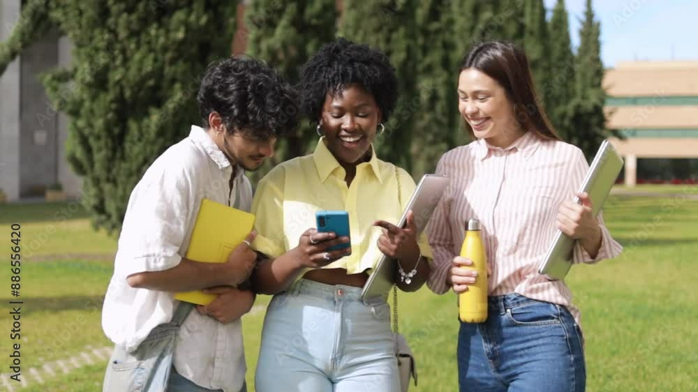 Diverse students using mobile phone at campus. Diverse students using mobile phone at campus.