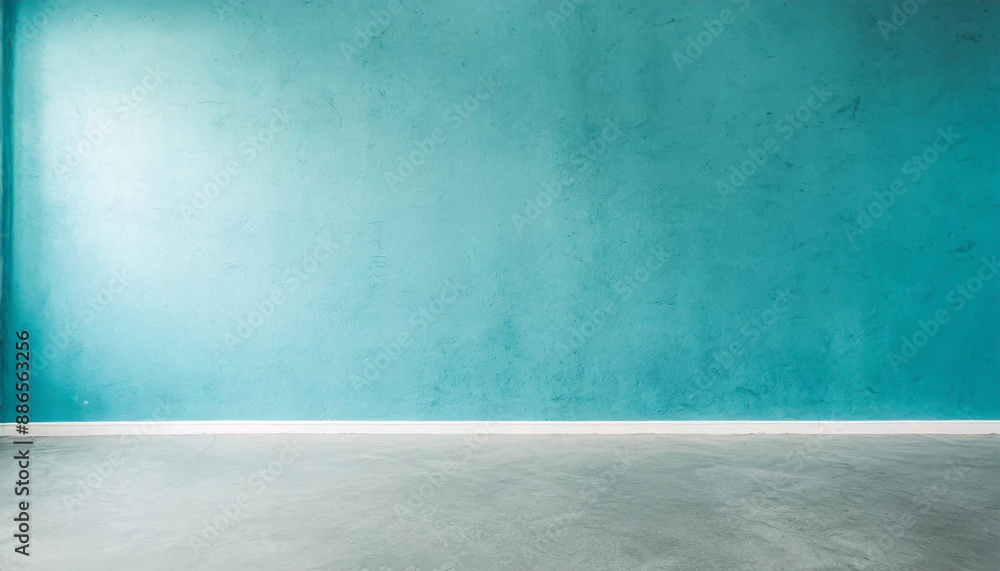 Blue wall in an empty room with concrete floor Blue wall in an empty room with concrete floor