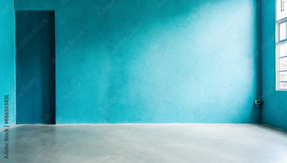 Blue wall in an empty room with concrete floor Blue wall in an empty room with concrete floor