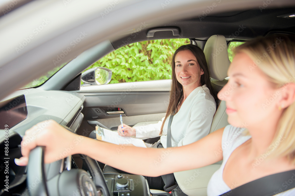 driver courses and people concept a car driving school instructor teaching young woman to drive driver courses and people concept a car driving school instructor teaching young woman to drive