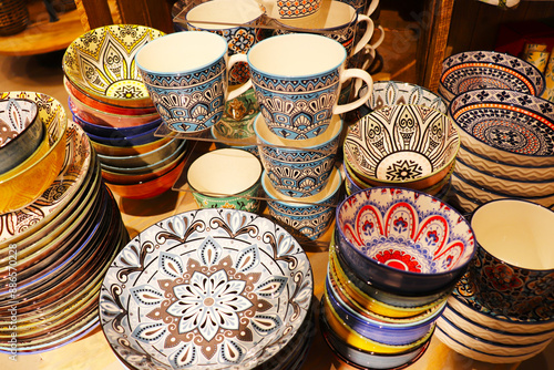 Festive ceramic tableware with Arabic pattern for festive table setting