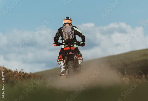 Professional enduro bike rider on action. Motocross sport.