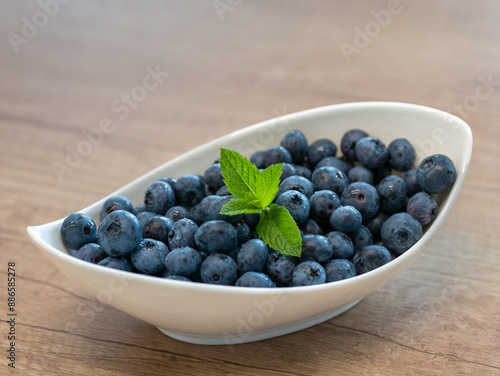 Wallpaper Mural The blue berries of the blueberry are the size of a pea. They can be eaten alone, used as a filling for cakes, fruit cups and can also be preserved. They are an excellent remedy against diarrhea. Torontodigital.ca