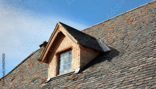 window on the with slates covered roof