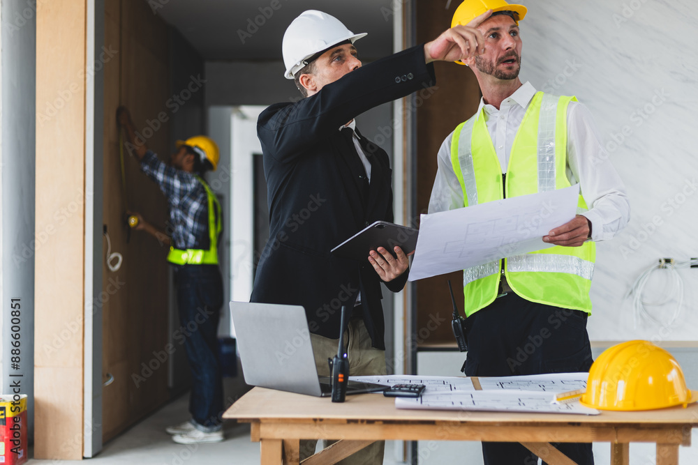 Businessman, contractors and engineers working at construction sites are construction inspector and supervise the work according to plans. Coworker cooperation and teamwork to ensure workplace safety. Businessman, contractors and engineers working at construction sites are construction inspector and supervise the work according to plans. Coworker cooperation and teamwork to ensure workplace safety.