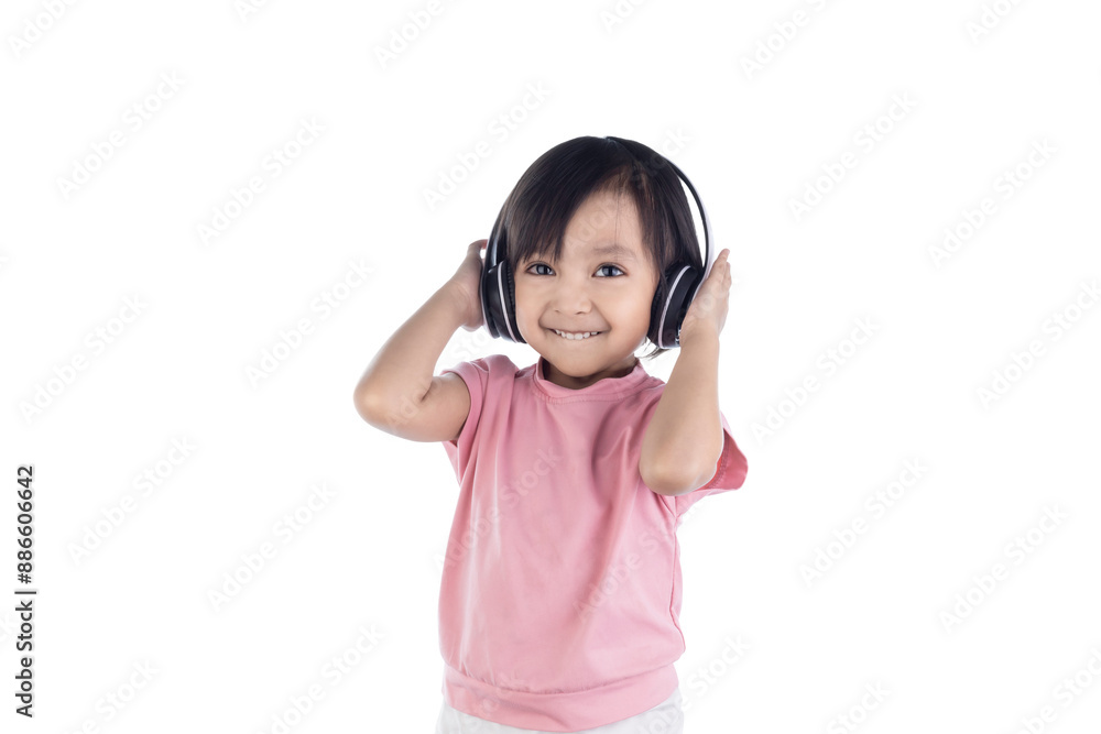 Asian little cute child girl wearing huge wireless headphones. preschool girl or kid listening to music isolated on white background with clipping paths. Asian little cute child girl wearing huge wireless headphones. preschool girl or kid listening to music isolated on white background with clipping paths.