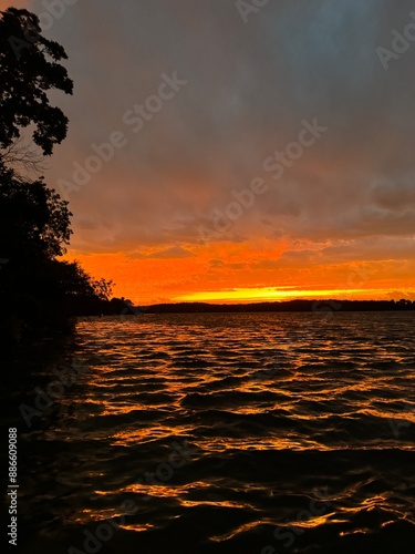 Vibrant sunset on the lake in summer