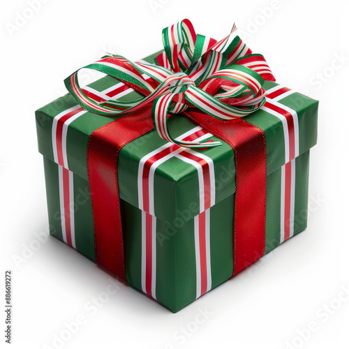 A festive Christmas gift box with red and green wrapping and a candy cane striped ribbon, isolated on white background