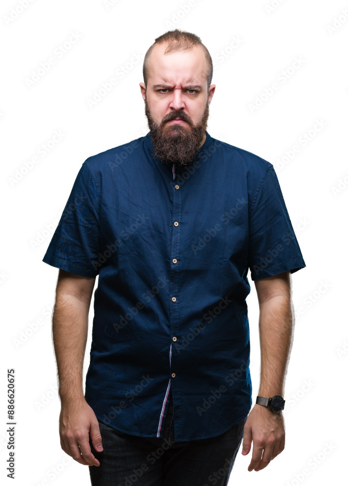 Young caucasian hipster man over isolated background skeptic and nervous, frowning upset because of problem. Negative person. Young caucasian hipster man over isolated background skeptic and nervous, frowning upset because of problem. Negative person.