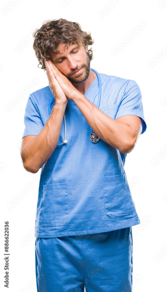 Handsome hispanic surgeon doctor man over isolated background sleeping tired dreaming and posing with hands together while smiling with closed eyes. Handsome hispanic surgeon doctor man over isolated background sleeping tired dreaming and posing with hands together while smiling with closed eyes.