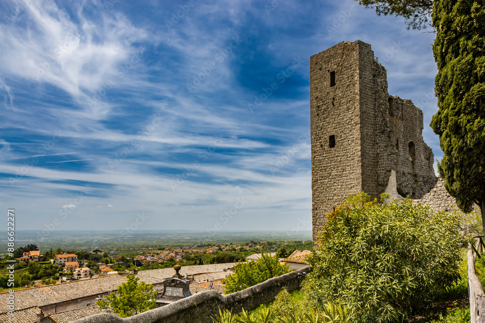 A glimpse of the ancient medieval village of Montefiascone, Viterbo, Italy. A detail of the medieval fortress of the Rocca dei Papi, which dominates the city. The imposing stone and brick building. A glimpse of the ancient medieval village of Montefiascone, Viterbo, Italy. A detail of the medieval fortress of the Rocca dei Papi, which dominates the city. The imposing stone and brick building.
