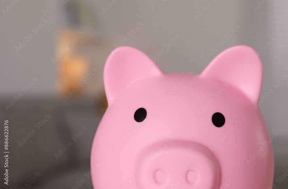 Pink piggy bank on blurred background, closeup Pink piggy bank on blurred background, closeup