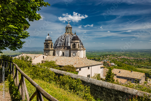 A glimpse of the ancient medieval village of Montefiascone, Viterbo, Italy. The Cathedral of Santa Margherita, with its large dome and the two bell towers, with clocks, on the sides.
