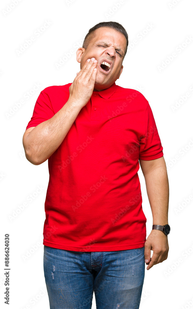 Middle age arab man over isolated background touching mouth with hand with painful expression because of toothache or dental illness on teeth. Dentist concept. Middle age arab man over isolated background touching mouth with hand with painful expression because of toothache or dental illness on teeth. Dentist concept.