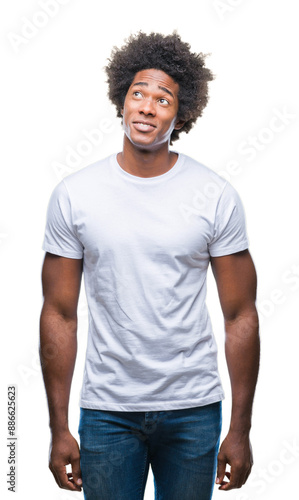 Afro american man over isolated background smiling looking side and staring away thinking.