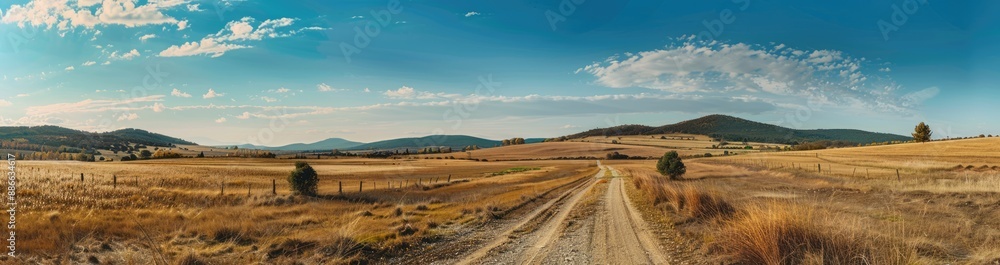 Obraz premium Rural Landscape with a Winding Country Road