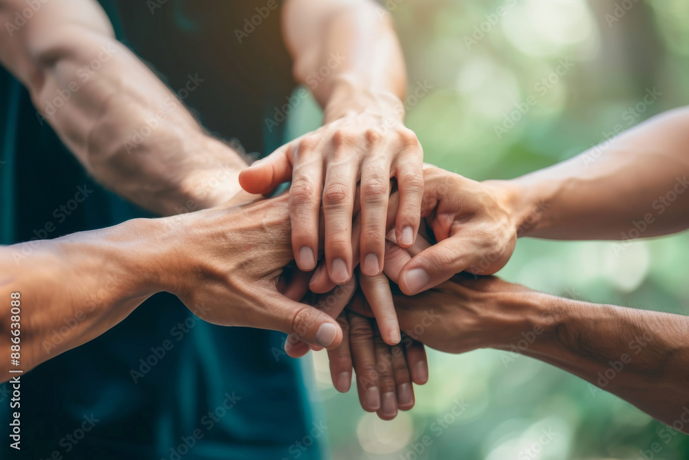 Teamwork concept with group of friends putting their hands together Teamwork concept with group of friends putting their hands together