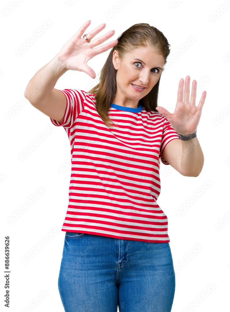 Middle age mature woman wearing casual t-shirt over isolated background Smiling doing frame using hands palms and fingers, camera perspective Middle age mature woman wearing casual t-shirt over isolated background Smiling doing frame using hands palms and fingers, camera perspective
