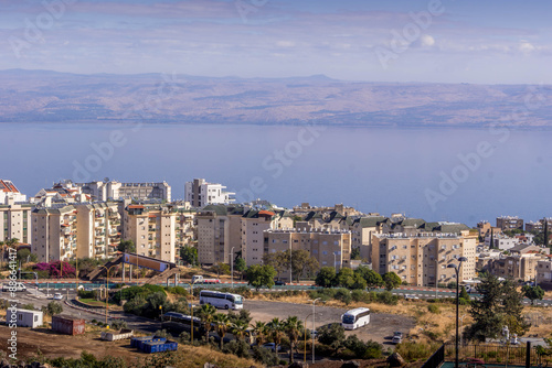 Slika na platnu The panorama view of Tiberias, the Israeli city on the Sea of Galilee, with modern houses, the Lake, and the Golan Heights, in Israel