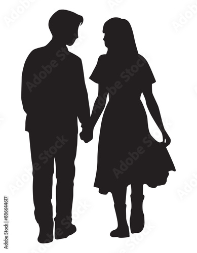 手をつないで顔を見合わせて歩くカップルのシルエット
