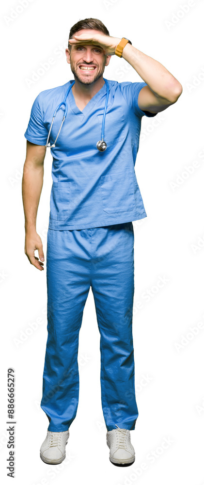 Handsome doctor man wearing medical uniform over isolated background very happy and smiling looking far away with hand over head. Searching concept. Handsome doctor man wearing medical uniform over isolated background very happy and smiling looking far away with hand over head. Searching concept.
