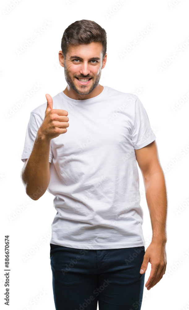 Young handsome man over isolated background doing happy thumbs up gesture with hand. Approving expression looking at the camera with showing success. Young handsome man over isolated background doing happy thumbs up gesture with hand. Approving expression looking at the camera with showing success.